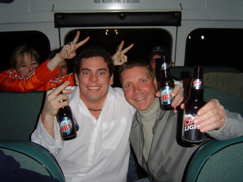 Brad and Gary holding $40 worth of beer