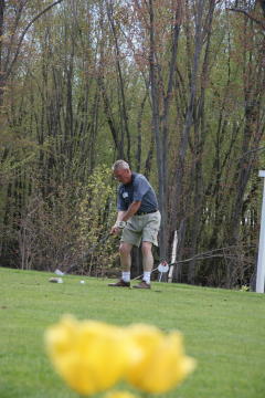Brian Curby tees off on the Par 3, 5th hole